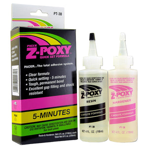 Packaging and bottles of Zap Z-Poxy quick set formula, a clear two-part epoxy adhesive, on a white background.